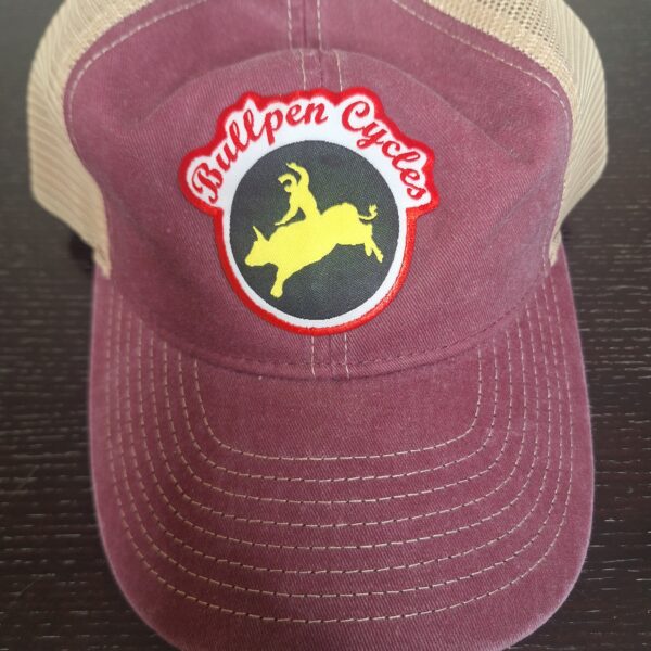 Maroon trucker hat with Bullpen Cycles patch