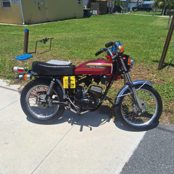 Classic red Harley-Davidson motorcycle on driveway